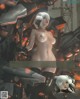 A naked woman standing in front of a giant robot.